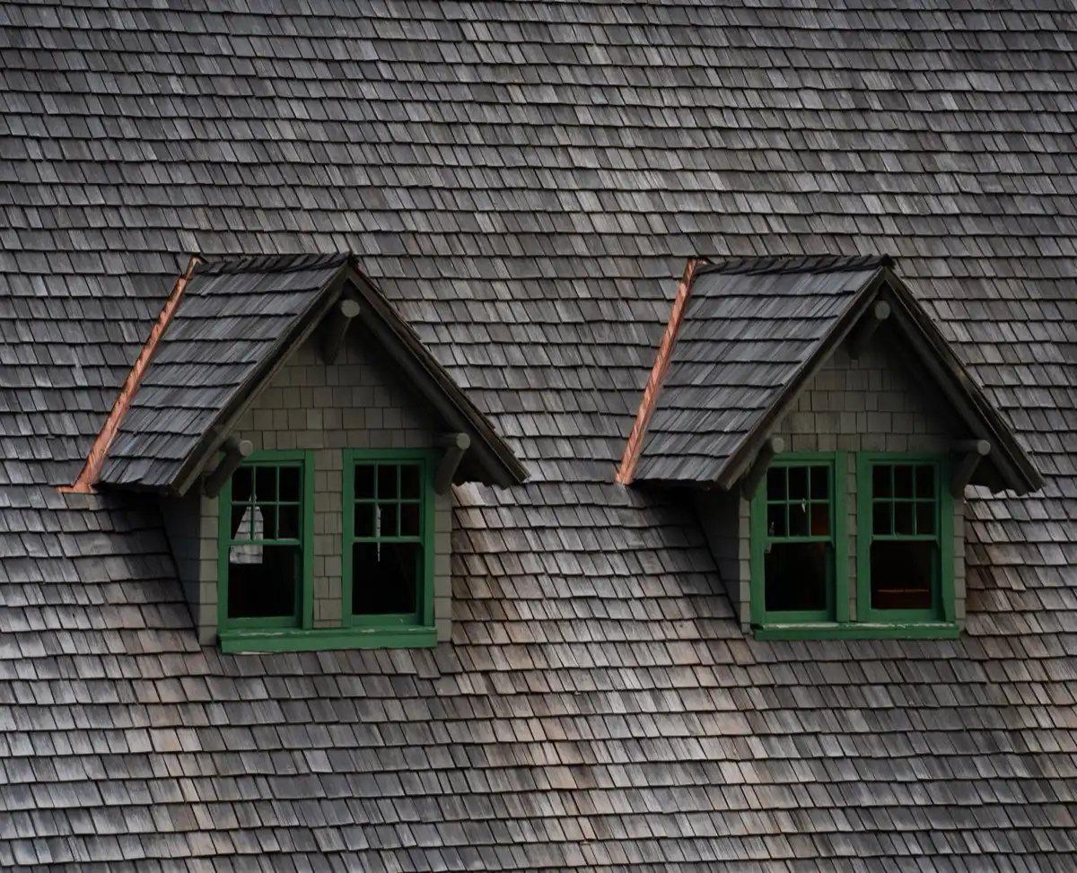 Dormers on a shingle roof in Fort Wayne, IN, where step flashing and kickout flashing carry water past the walls