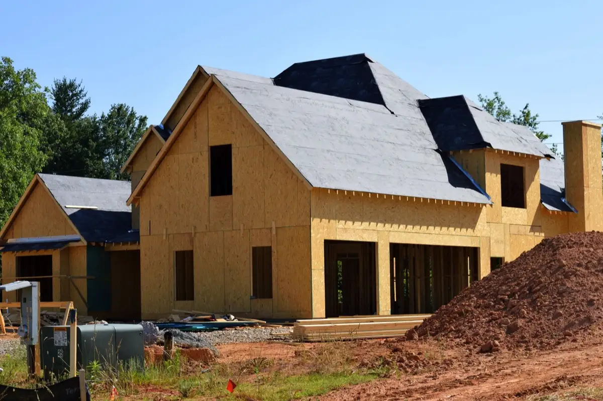 House with new roof decking and synthetic underlayment during a roof replacement in Fort Wayne, IN